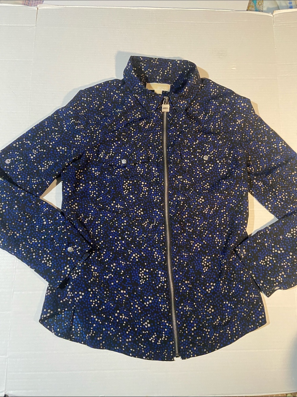 Michael Kors navy blue zip-front blouse with an all-over star and dot pattern